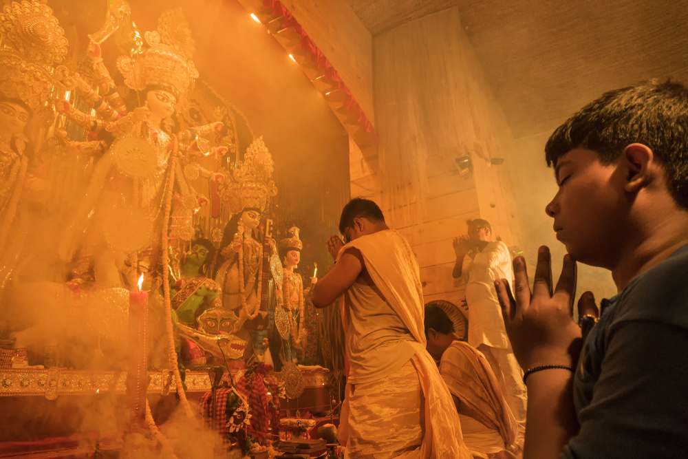 Hindu Priest worshipping Goddess Durga