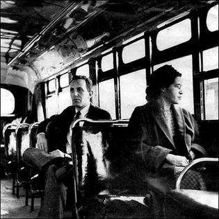Rosa Parks sits in the front of a bus