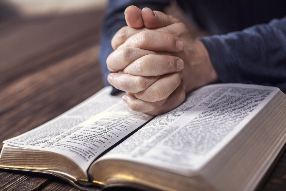 Man reading from the holy bible