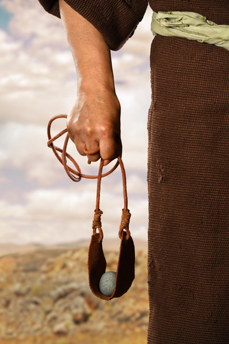 David holding sling shot with stone